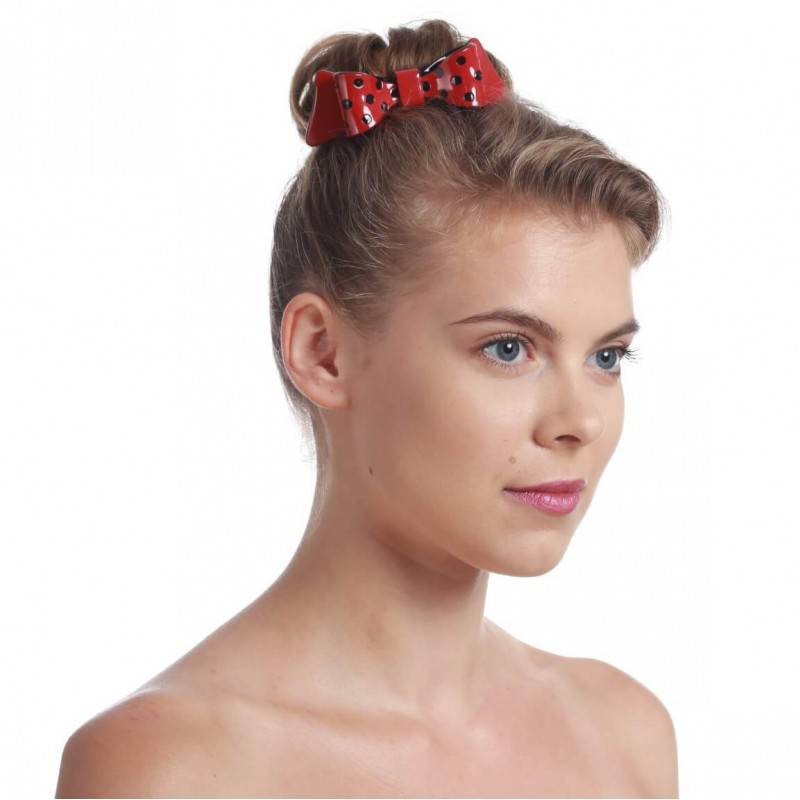 model with red bow hair barrette